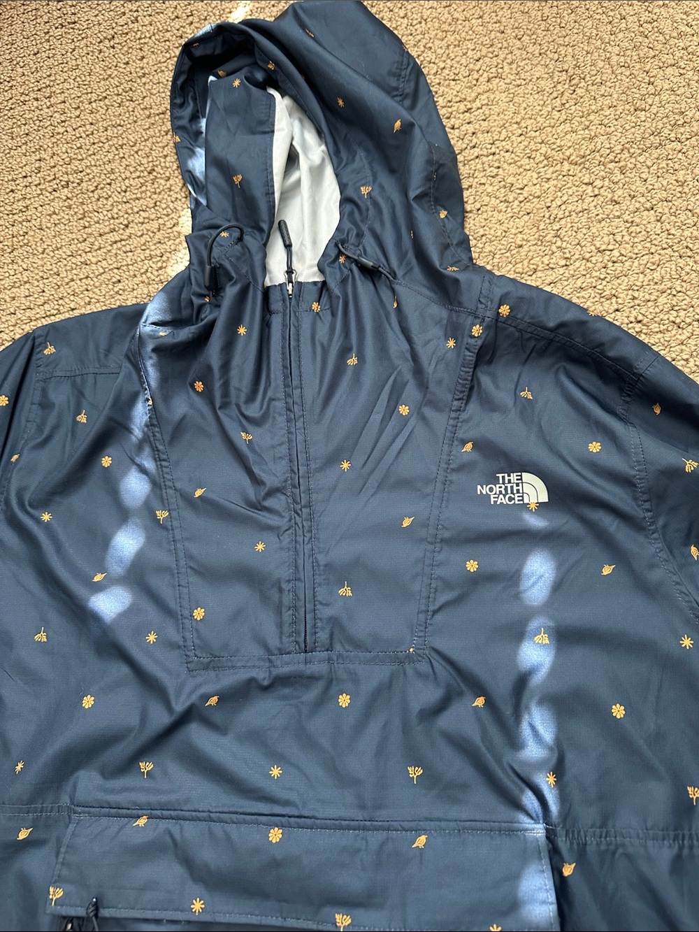 The North Face Navy packable Hooded Pullover windbreaker with Gold Motif